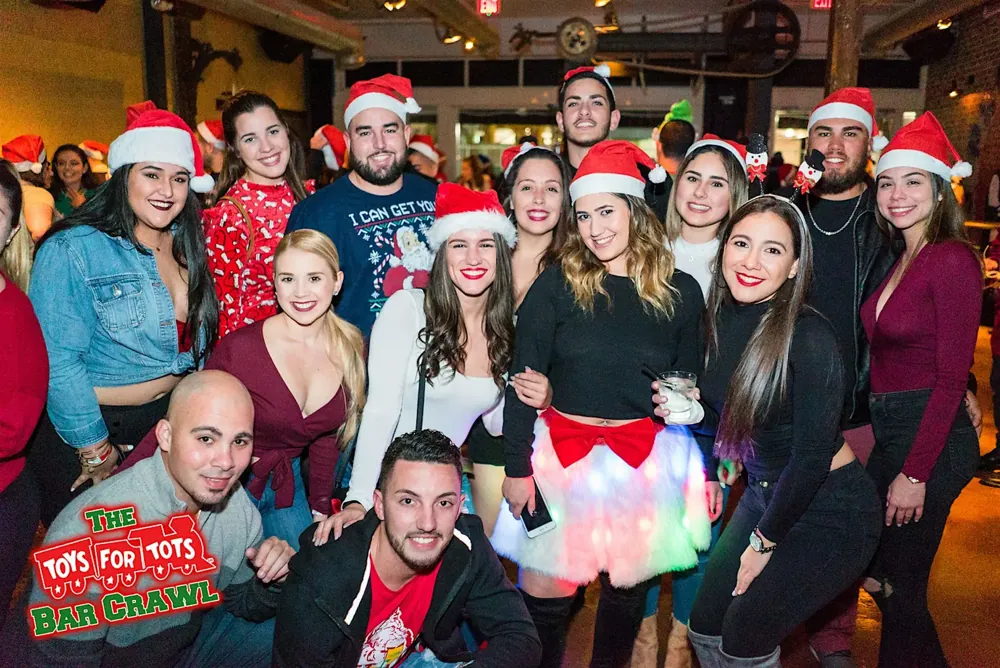 Christmas Bar Crawl crowd having fun at a crawl venue