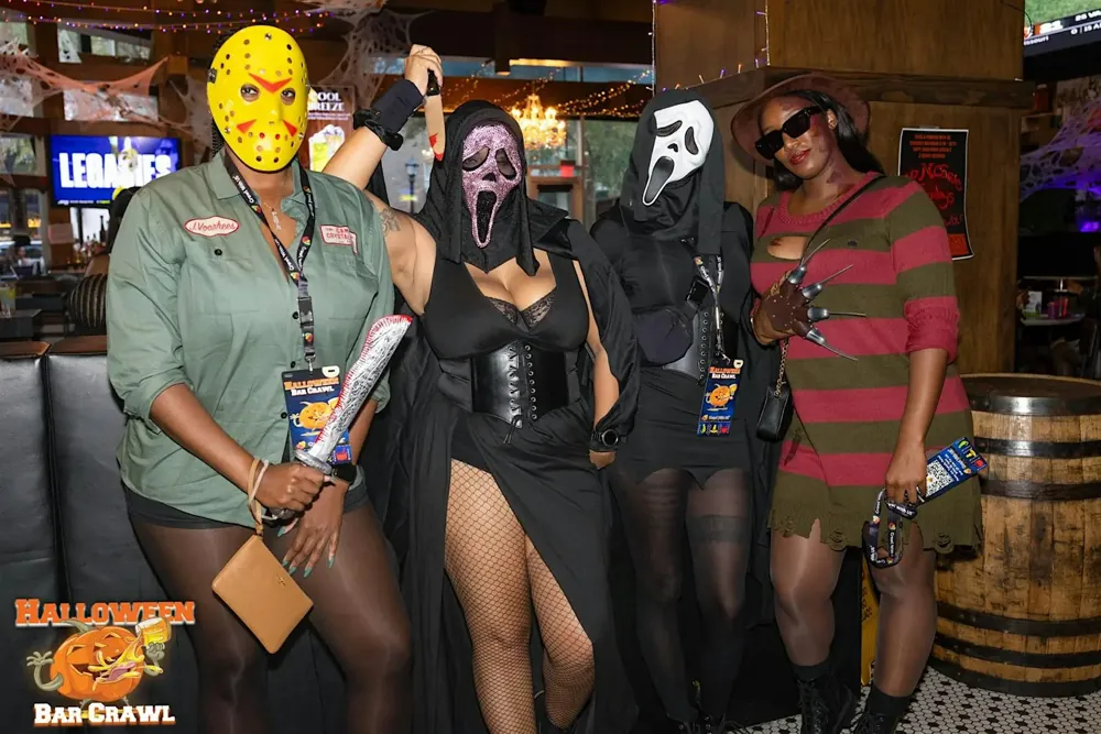 Friends in costume on the Halloween bar crawl