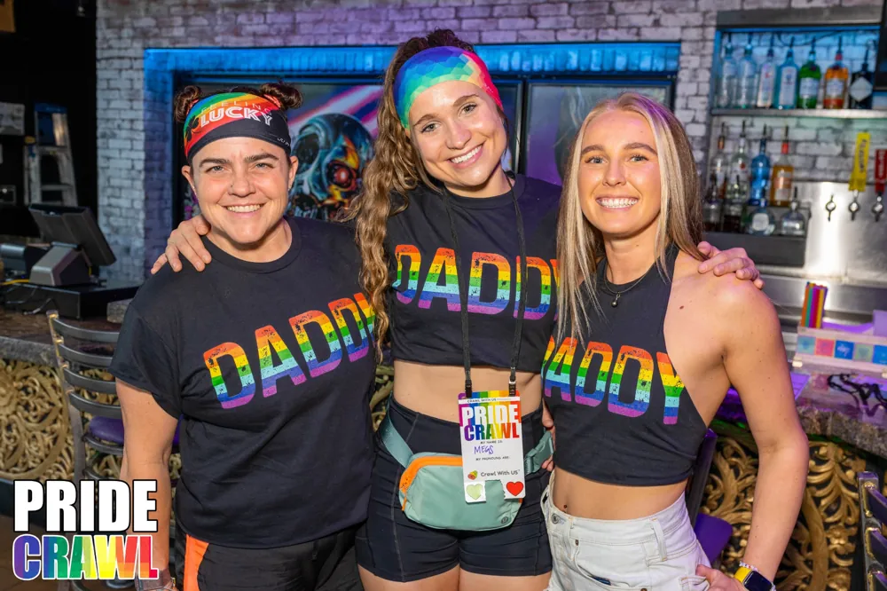 Pride crawlers celebrating during the bar crawl