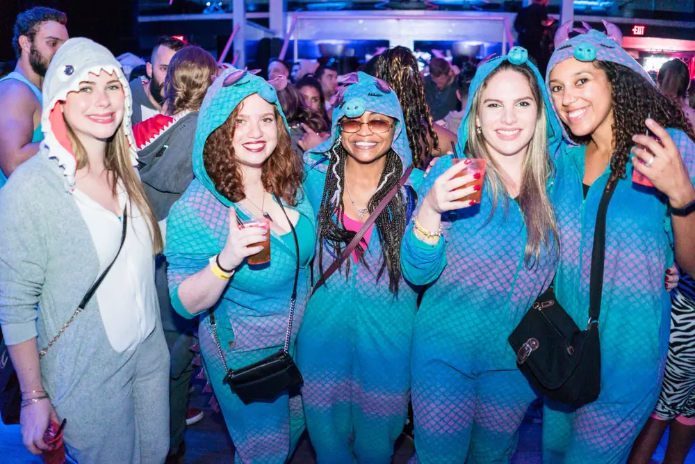 Crawlers in onesies at the after-party with the DJ