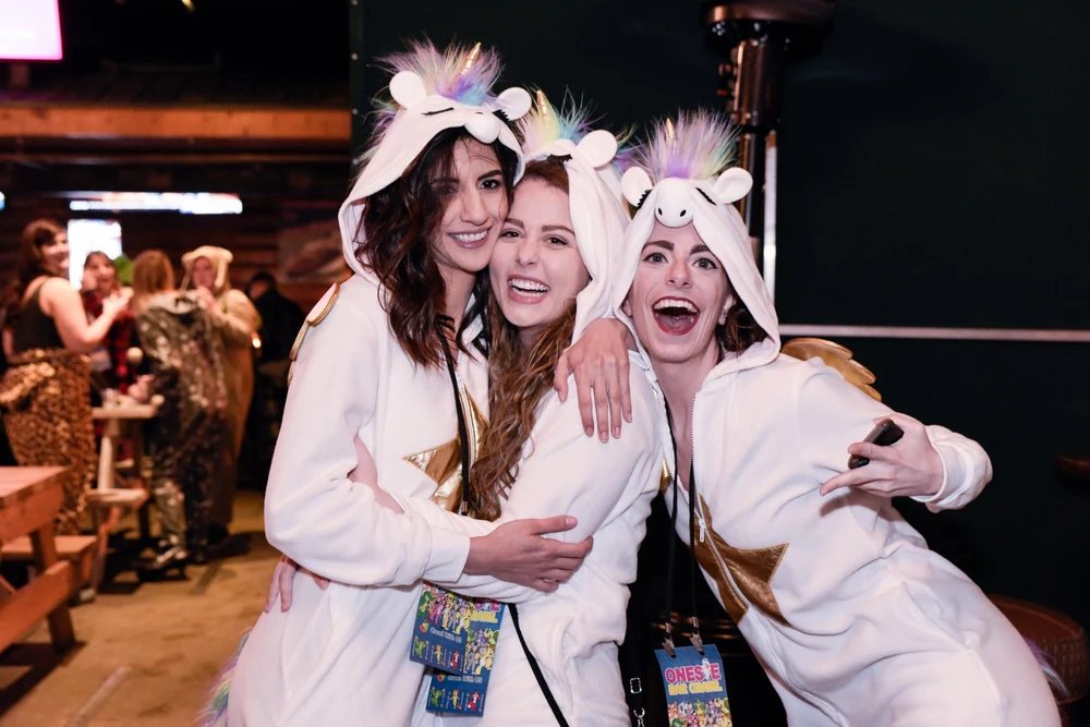 Onesie Bar Crawl crowd having fun at a crawl venue